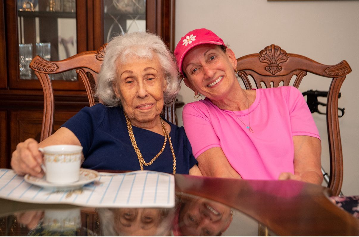 Volunteer visiting a senior