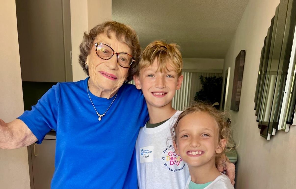 Volunteer and senior smiling